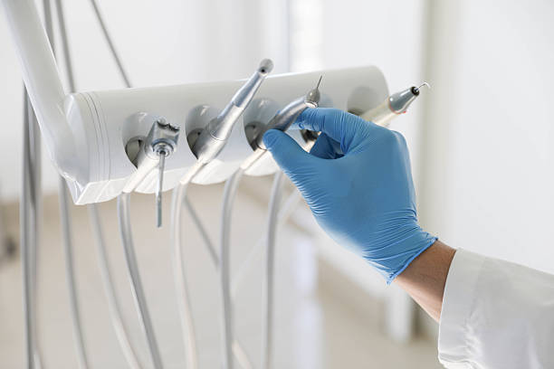 Professional Tooth Extraction technician working in Lawrence, IN